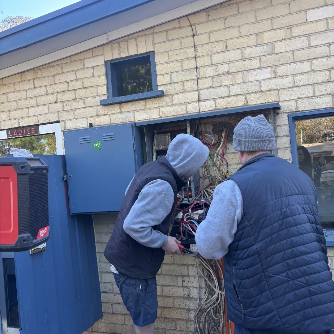 RB Solar & Electrical electricians working on a switchboard